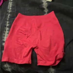 Strength amplify  shorts in the color fushia pink in size small
